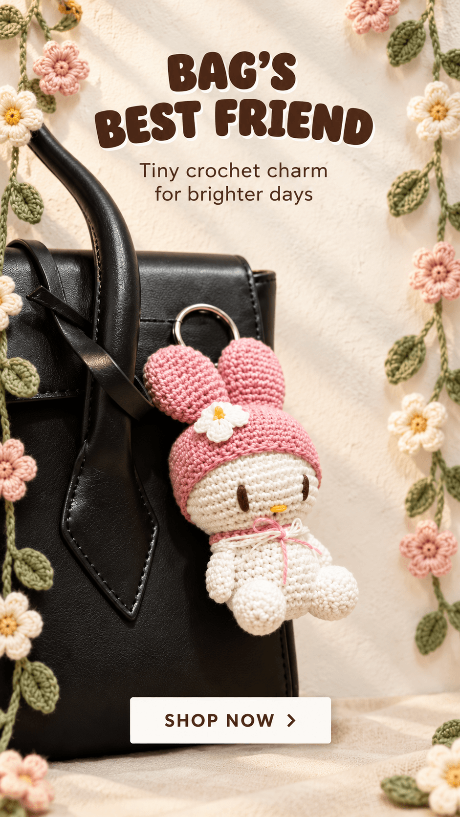 Crochet bunny bag charm on a handbag with Bag's Best Friend promotional art